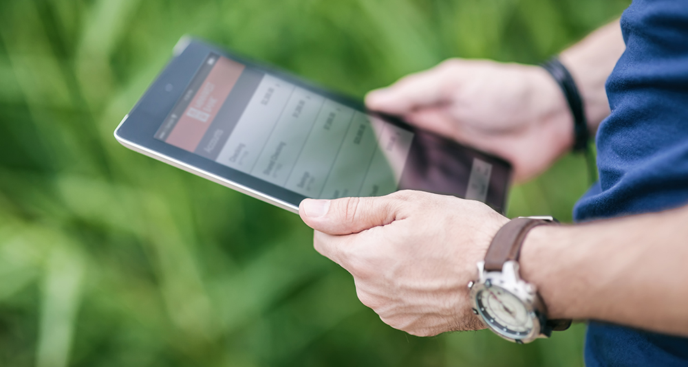 man holding tablet device